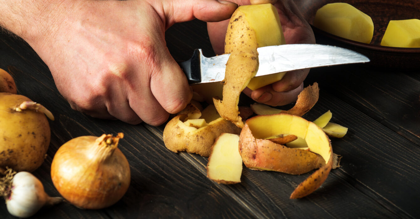 peeling-potatoes-kitchen-by-hands-cook-with-knife-preparing-national-dish-1340x701.jpg