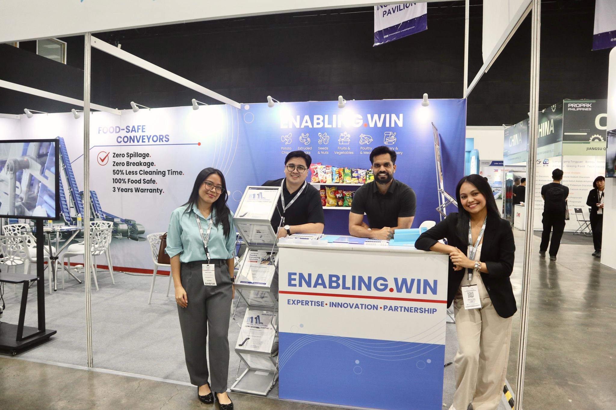 Enabling.Win team of conveyor specialists at trade show booth