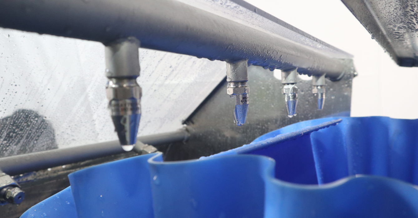 Clean-In-Place Attachment on Hygienic Open Frame Conveyor